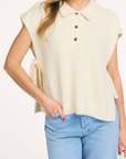 VAREE Polo strap fluffy knitted top gebroken wit